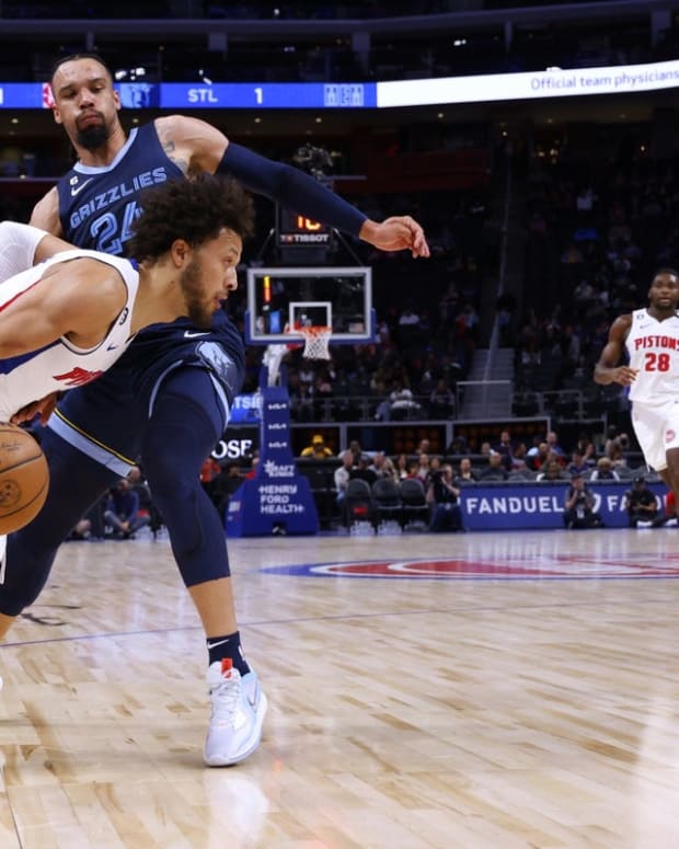 Oct 13, 2022; Detroit, Michigan, USA; Detroit Pistons guard Cade Cunningham (2) dribbles by Memphis Grizzlies forward Dillon Brooks (24) in the first half t Little Caesars Arena. Mandatory Credit: Rick Osentoski-USA TODAY Sports